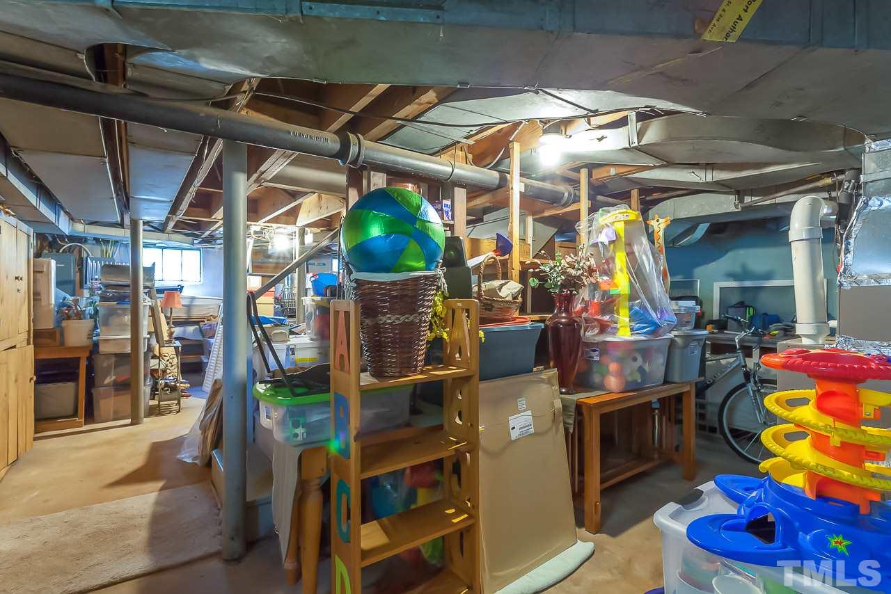 2518 Beechridge Road Raleigh, NC 27608 - Photo 23 of 25 a view of store room with wooden floor