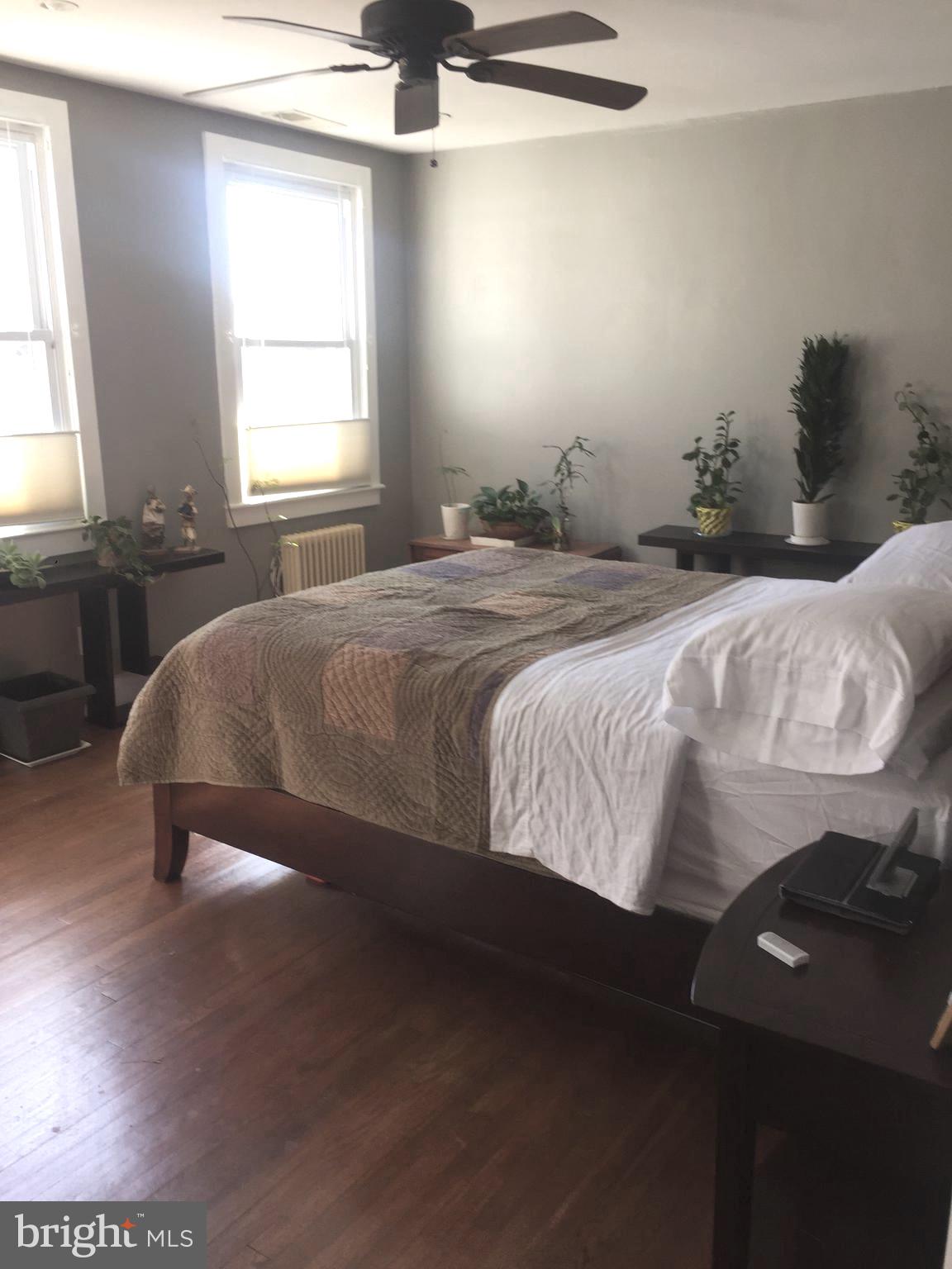 5203 Falls Road, Unit 16 Baltimore, MD 21210 - Photo 14 of 25 a bedroom with a bed and window
