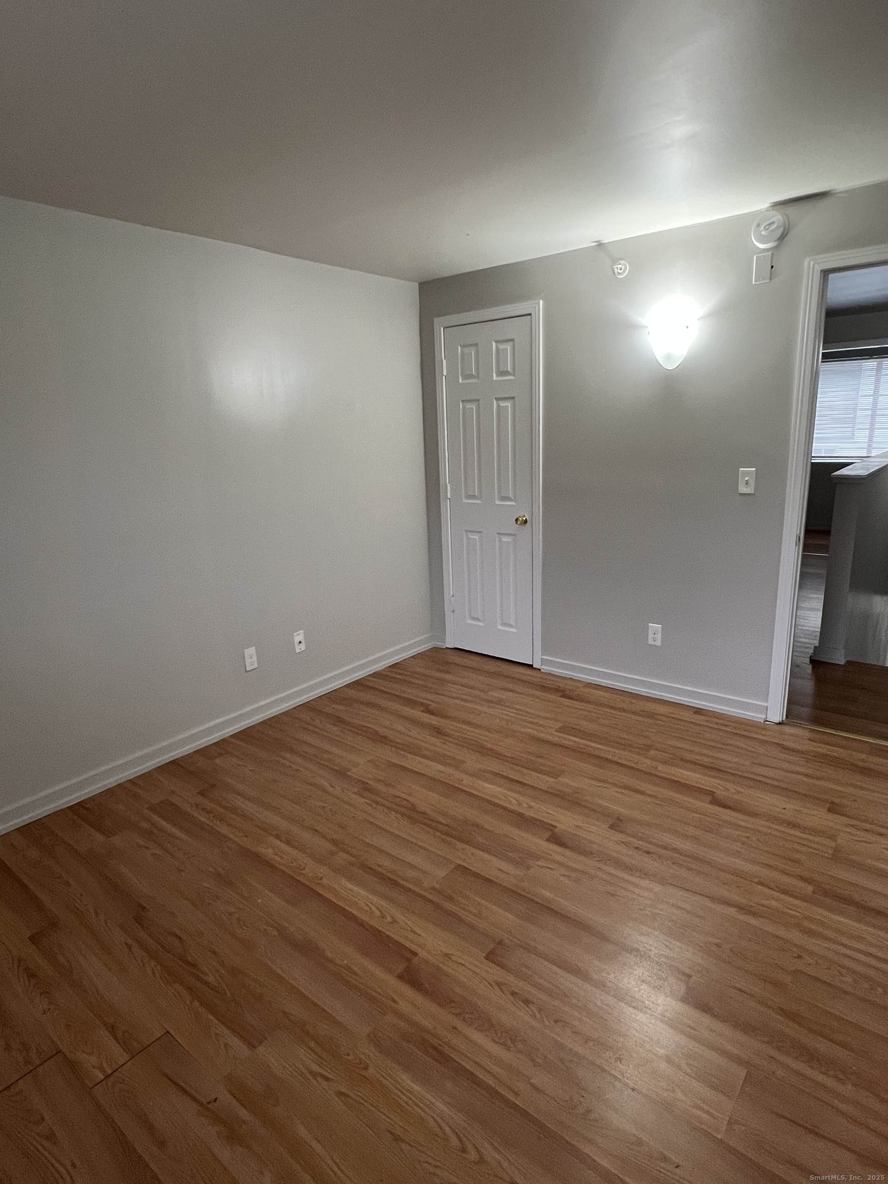 385 Putnam Avenue, Unit 38 Hamden, CT 06517 - Photo 10 of 15 wooden floor in an empty room