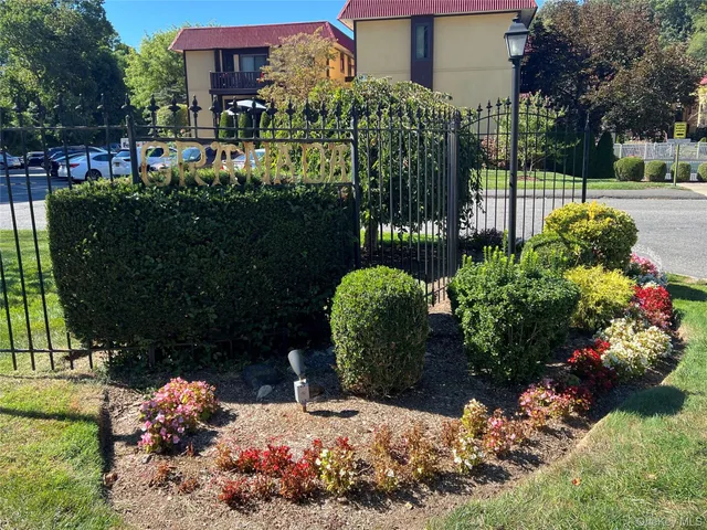 a bunch of flowers and covered with tall buildings