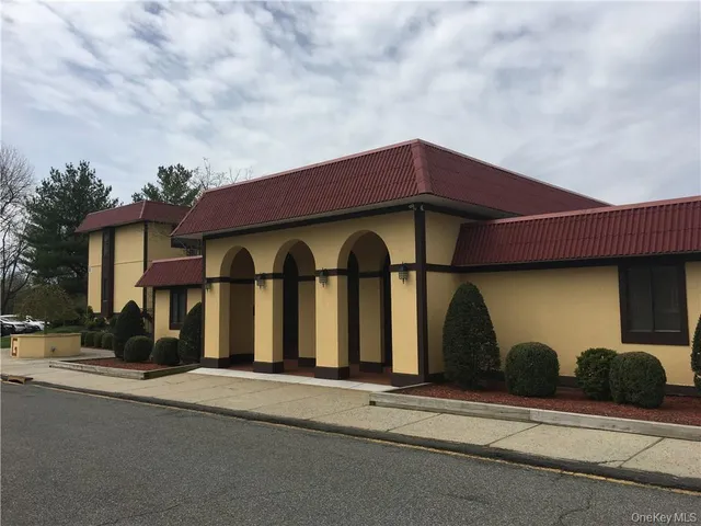 a front view of a house with garage