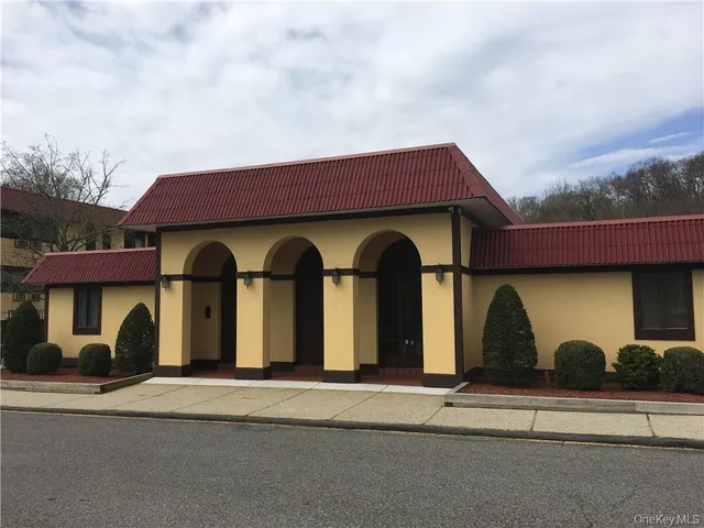 a front view of a house with garage