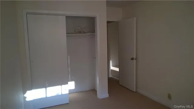 a bathroom with a sink and mirror with toilet