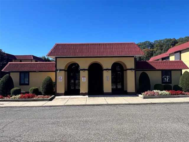 a couple of table and chairs in front of a building