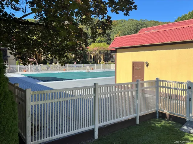 a view of a patio with a table and a chairs