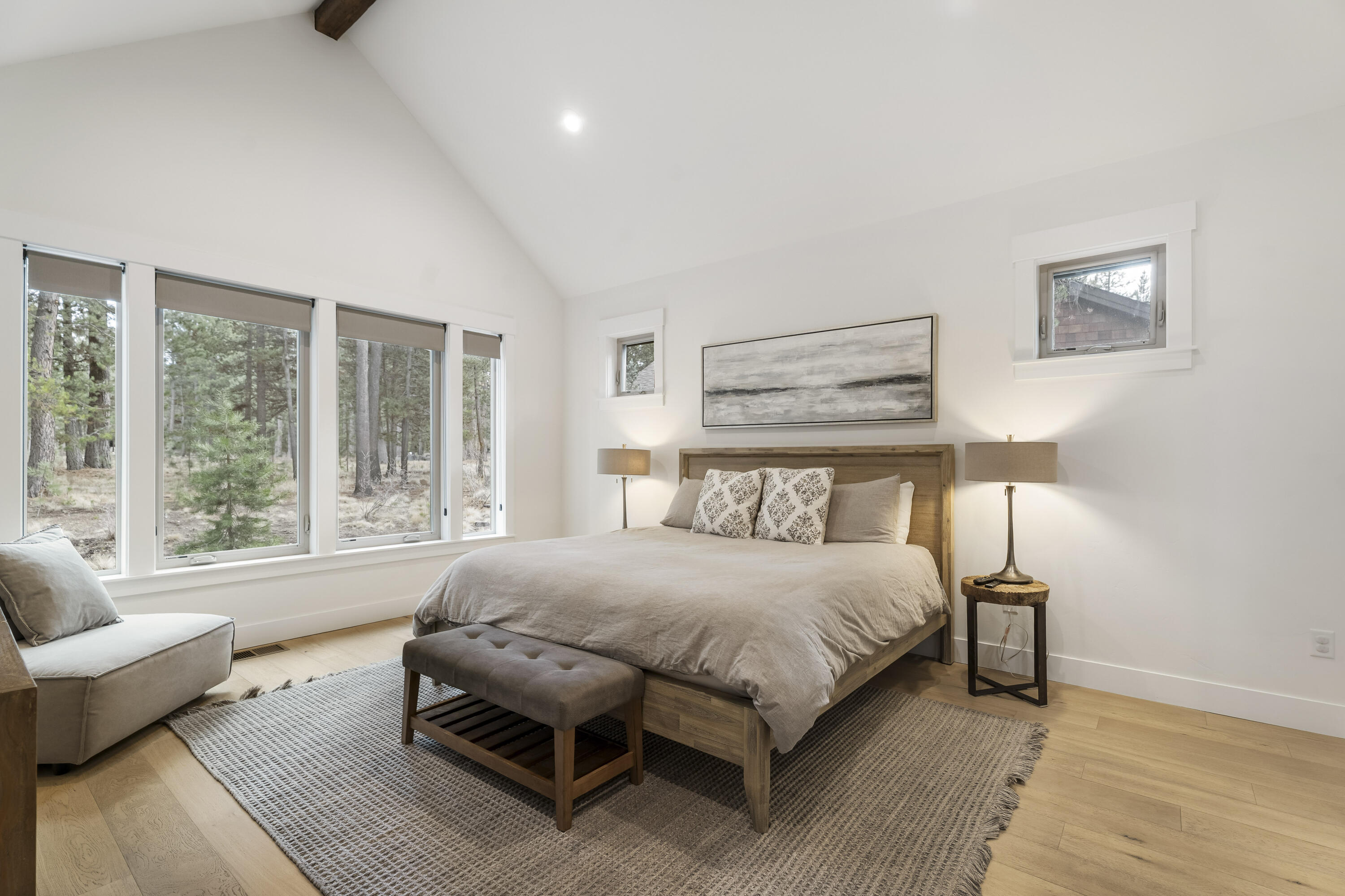 56302 Sable Rock Loop, Unit 255 Bend, OR 97707 - Photo 22 of 65 a bedroom with a bed and wooden floor