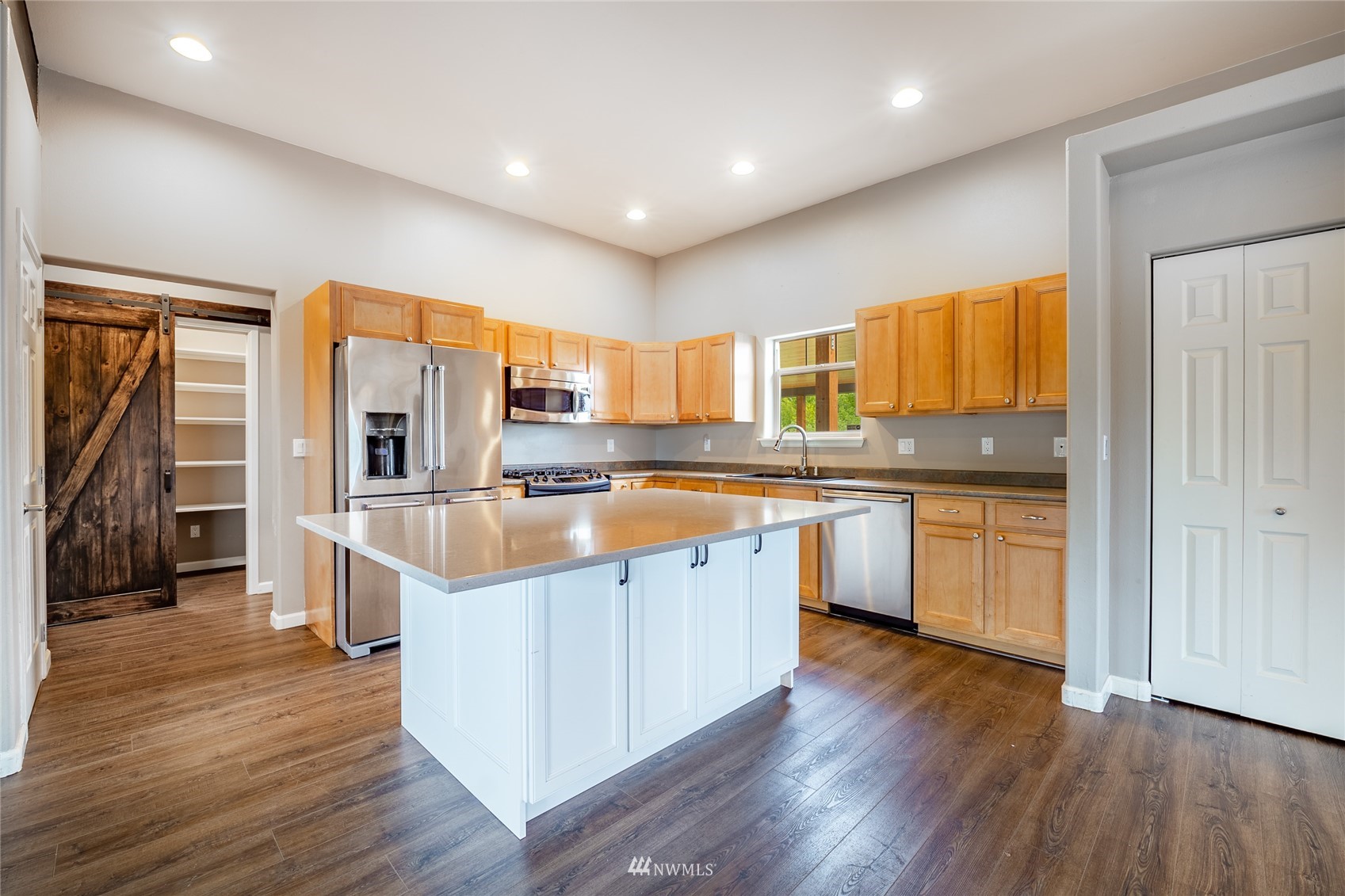 6184 Olson Road Ferndale, WA 98248 - Photo 5 of 40 a kitchen with stainless steel appliances granite countertop a sink a stove and a refrigerator