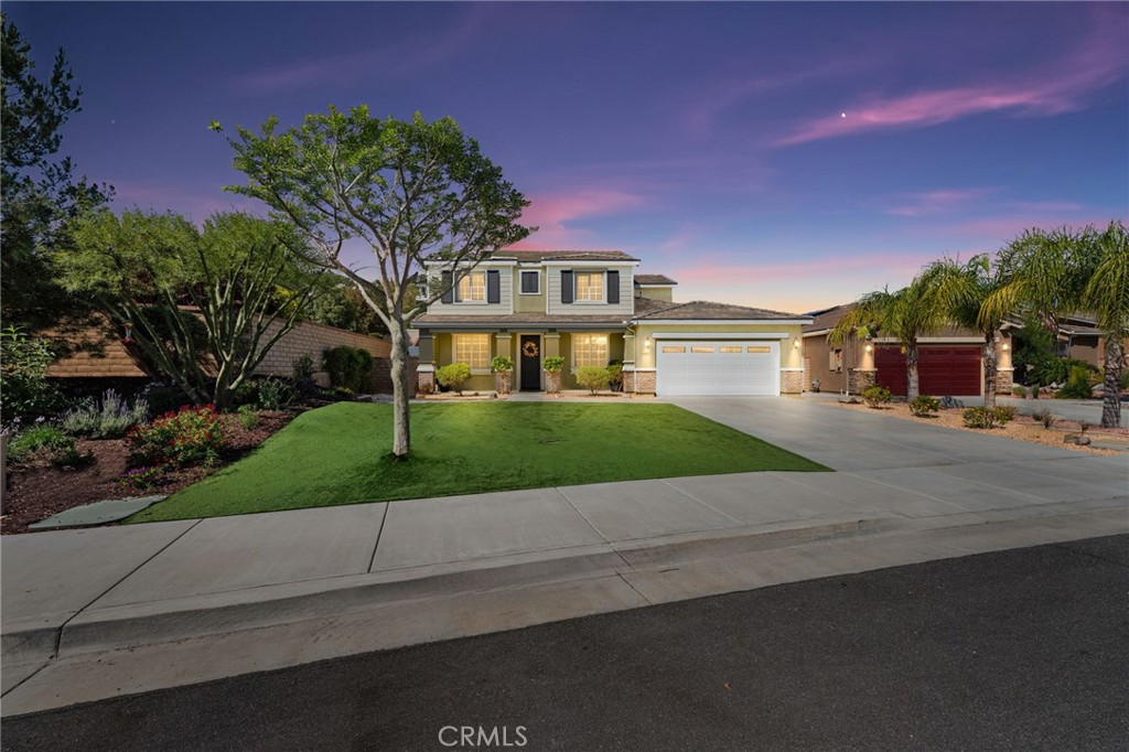 30711 Rattle Dance Way Menifee, CA 92584 - Photo 1 of 1 a front view of a house with a yard and garage