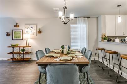 4009 Sheraton Road Denton, TX 76209 - Photo 11 of 35 a view of a dining room with furniture window and wooden floor