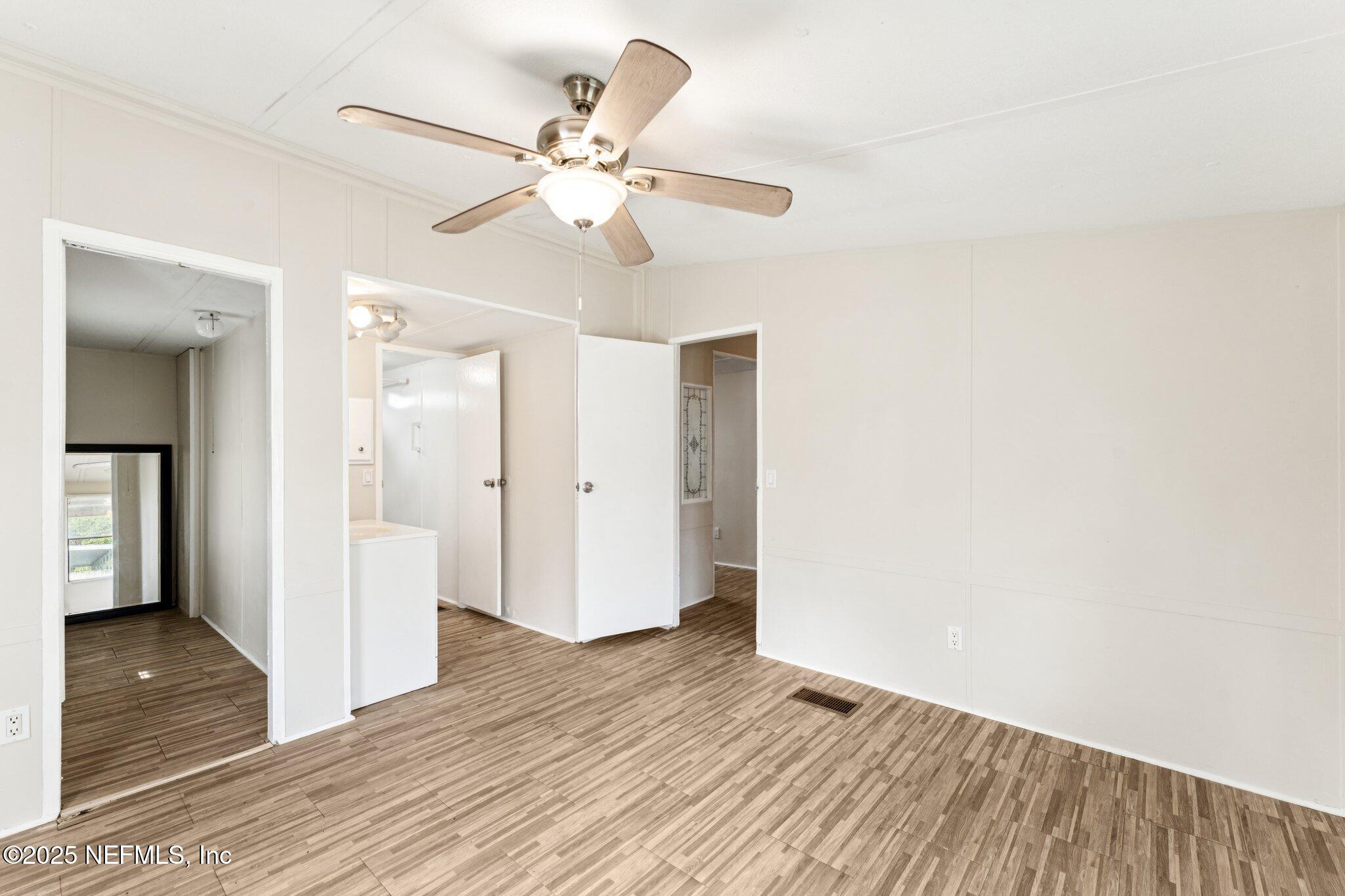 781 Hamilton Avenue St. Augustine, FL 32084 - Photo 19 of 39 a view of a livingroom with wooden floor