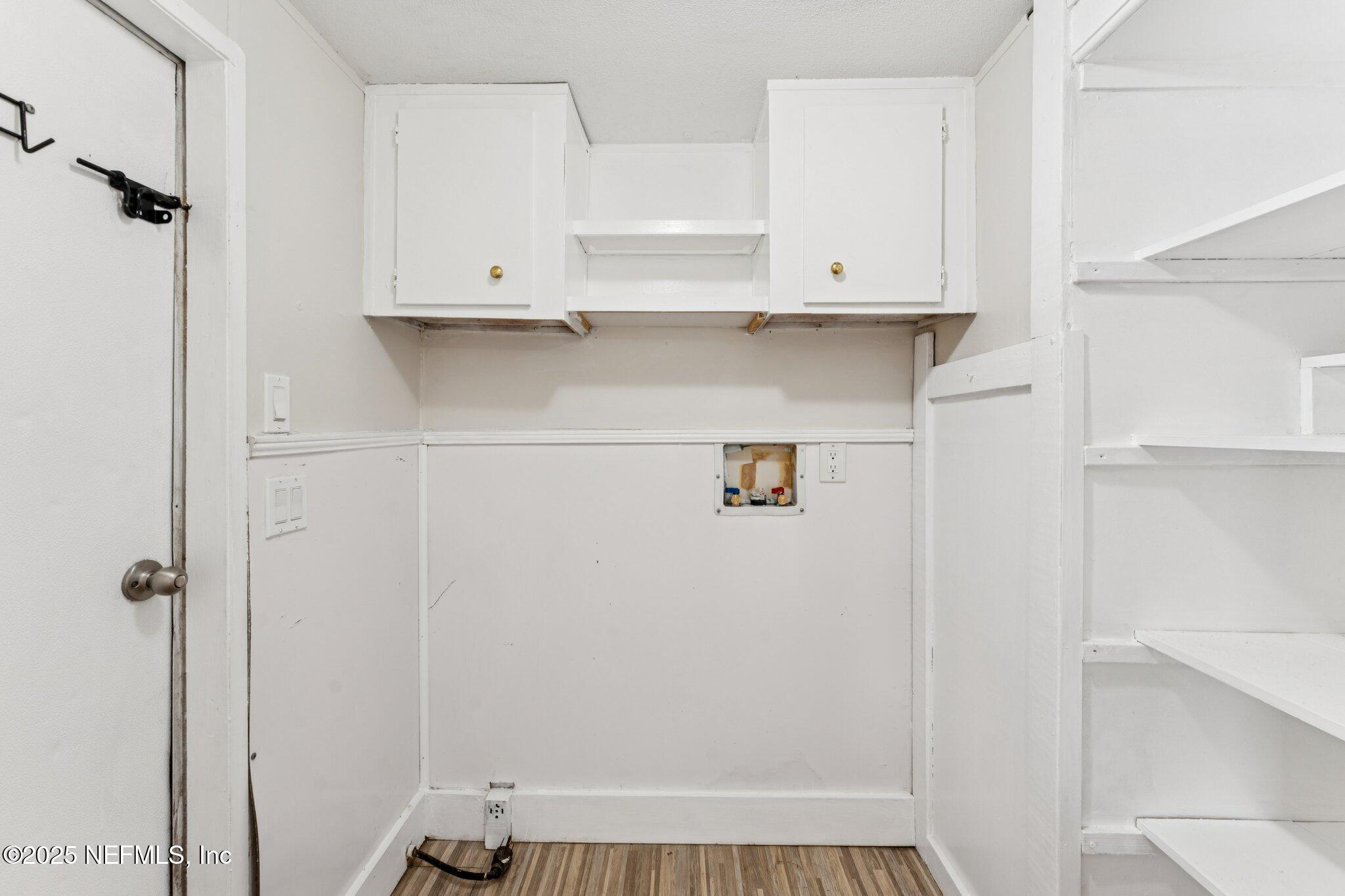 781 Hamilton Avenue St. Augustine, FL 32084 - Photo 25 of 39 a view of cabinets and wooden door