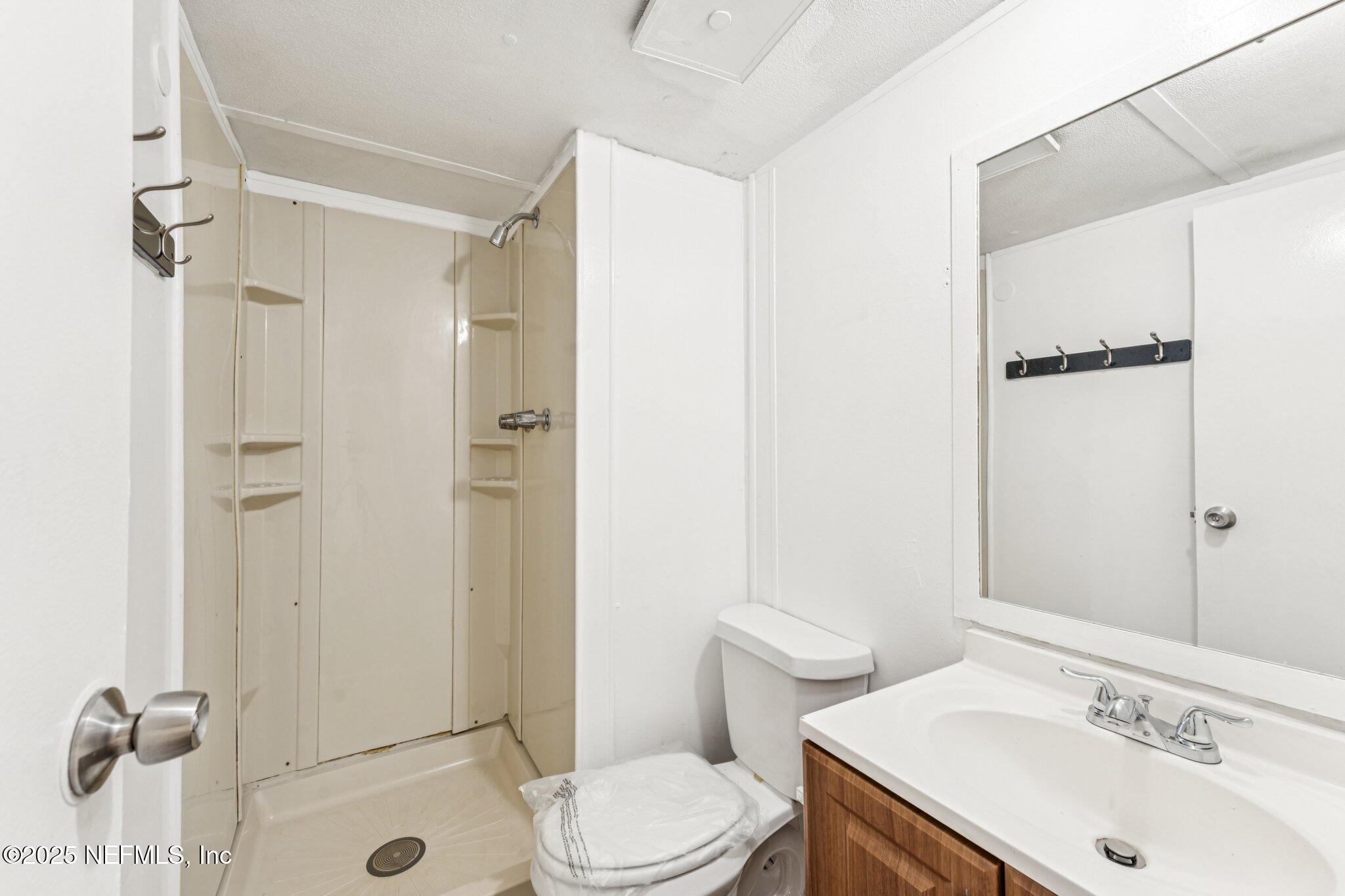 781 Hamilton Avenue St. Augustine, FL 32084 - Photo 26 of 39 a bathroom with a sink toilet and shower