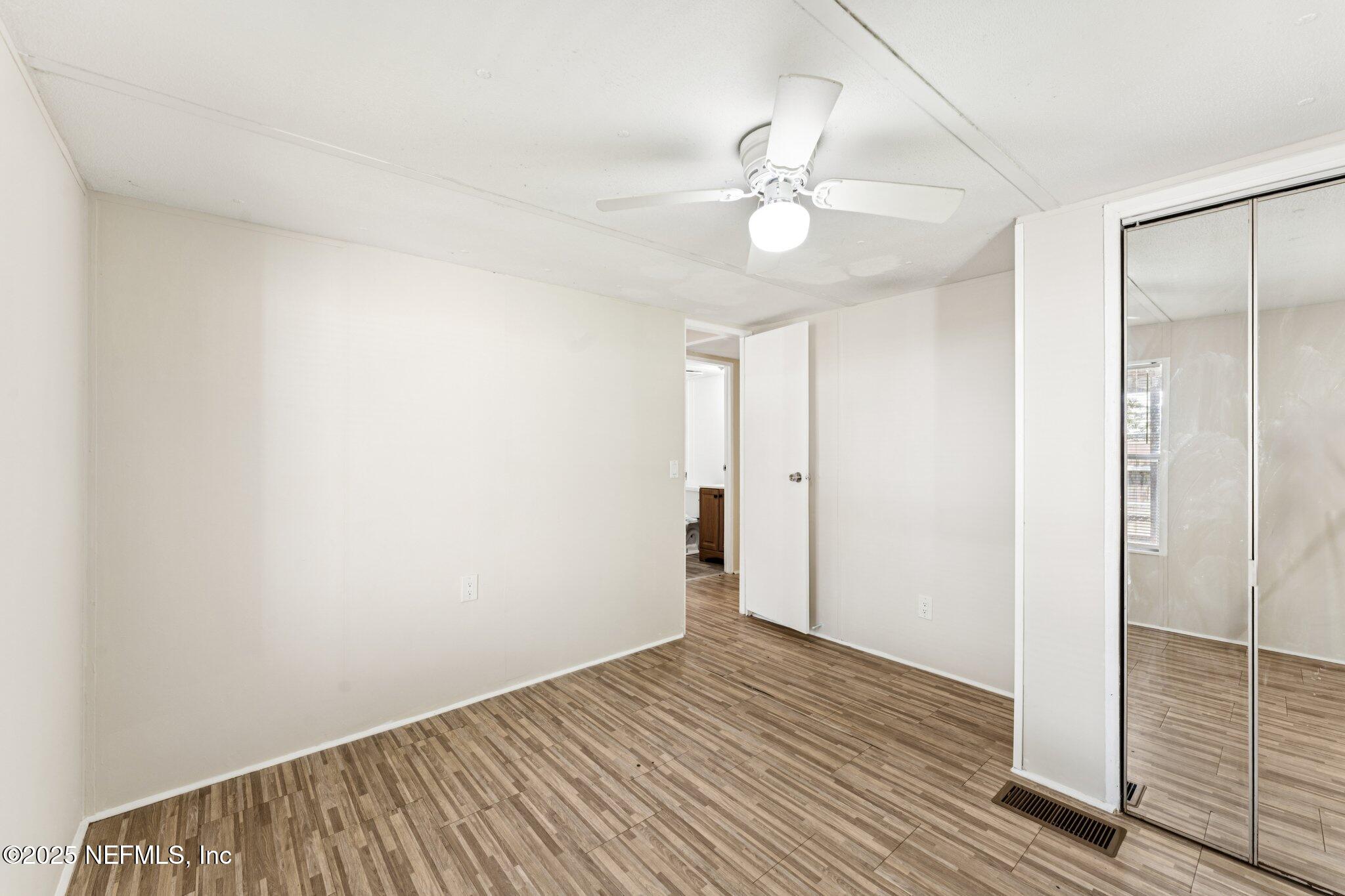 781 Hamilton Avenue St. Augustine, FL 32084 - Photo 30 of 39 a view of an empty room with wooden floor