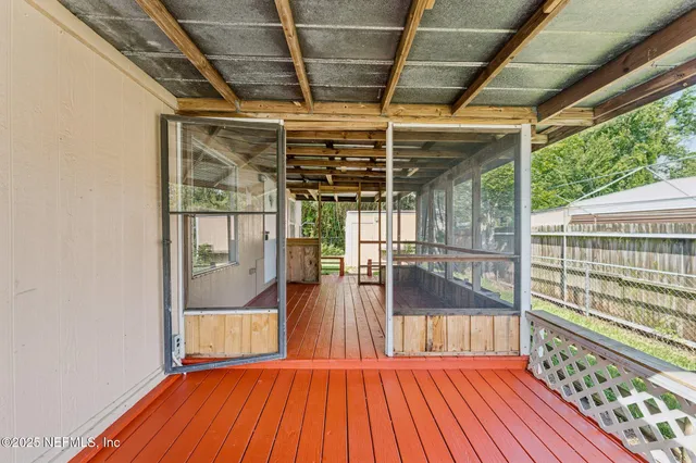 a view of porch with wooden floor