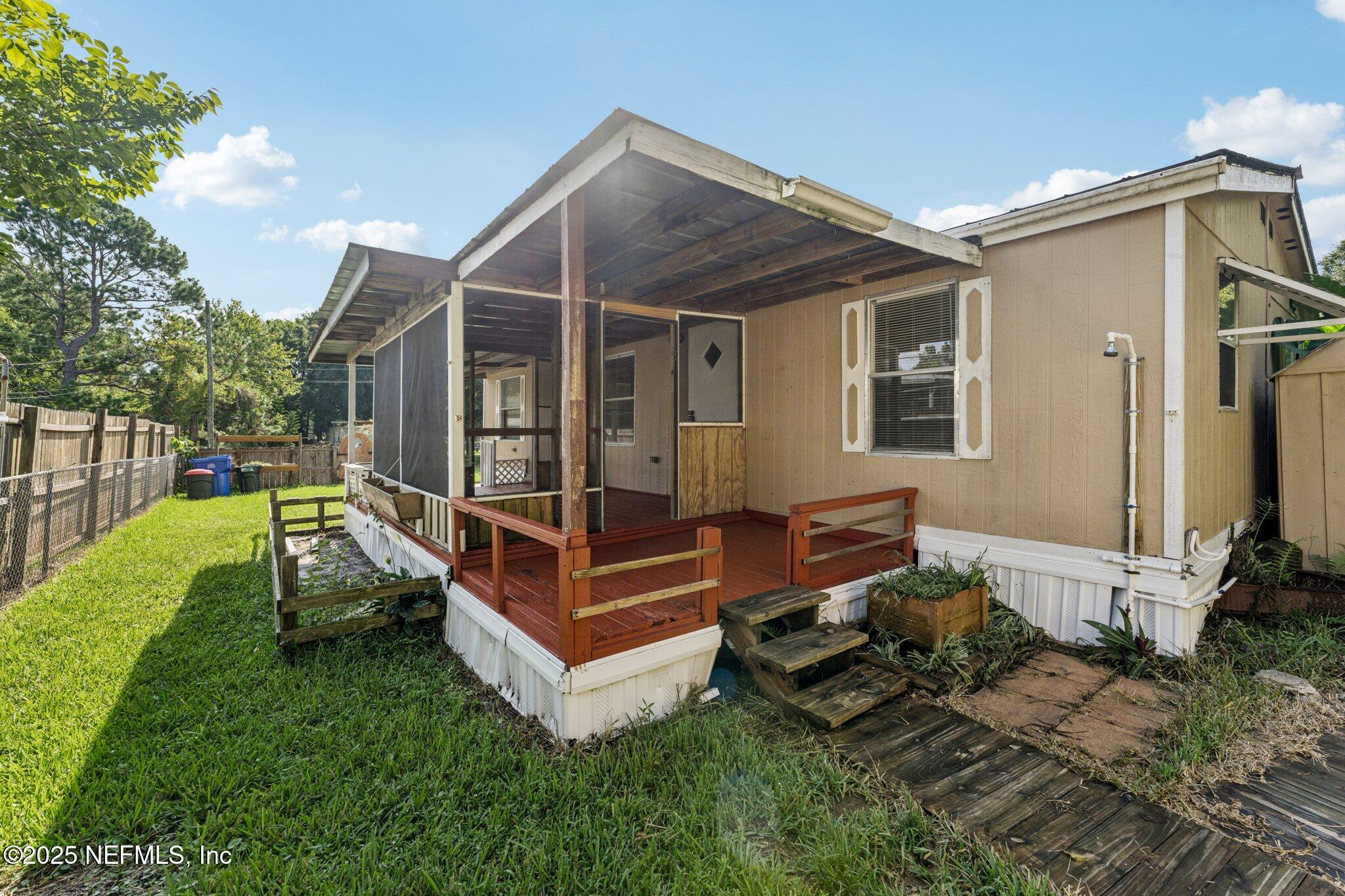 781 Hamilton Avenue St. Augustine, FL 32084 - Photo 38 of 39 a view of a house with backyard sitting area and garden