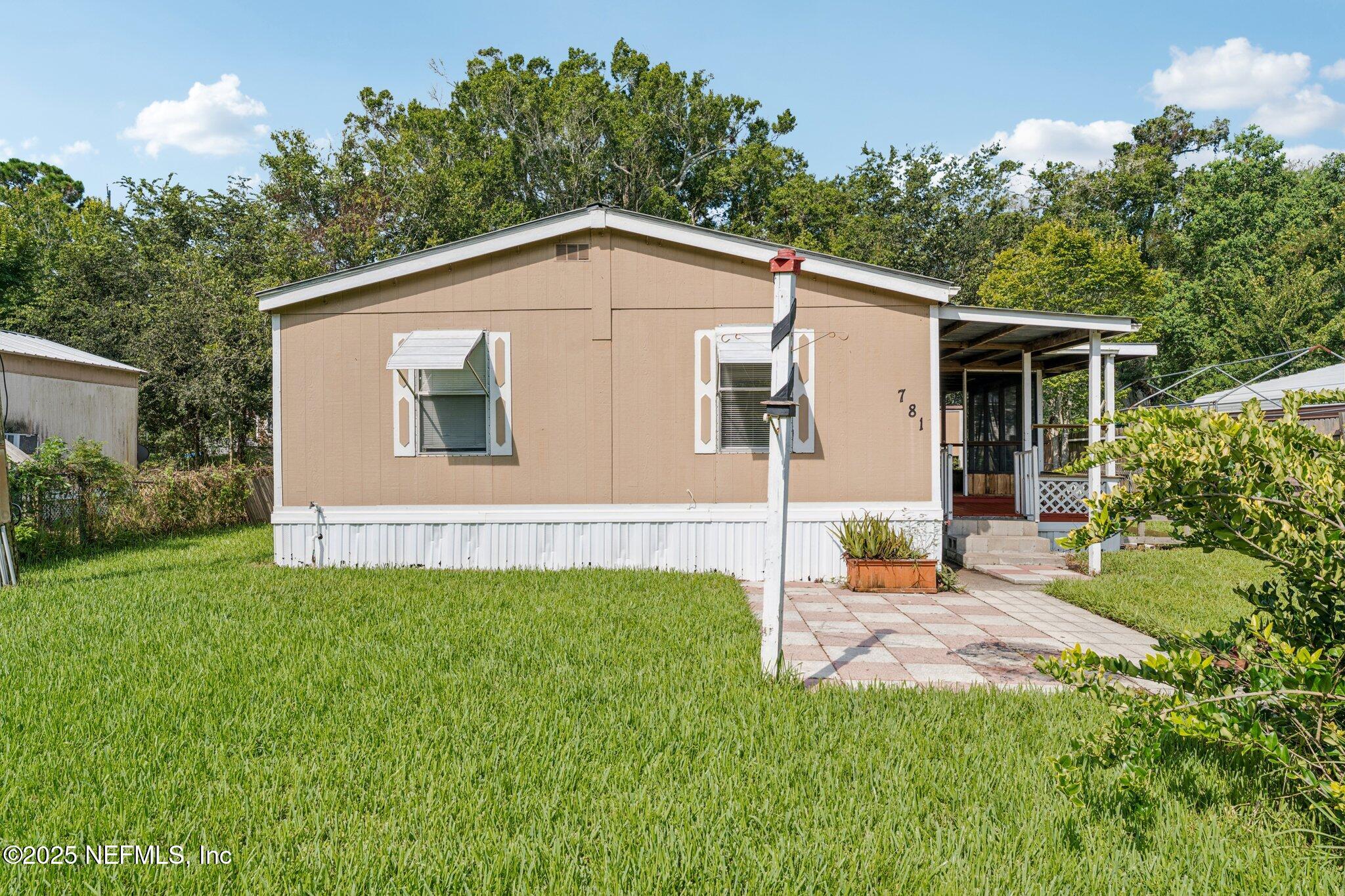 781 Hamilton Avenue St. Augustine, FL 32084 - Photo 4 of 39 a view of a house with backyard and garden