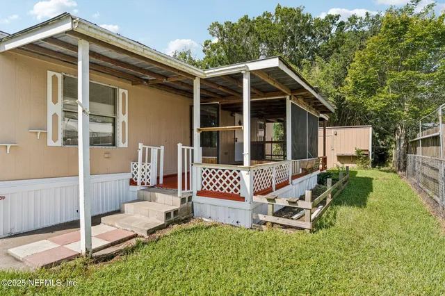 a wooden bench sitting in front of a house