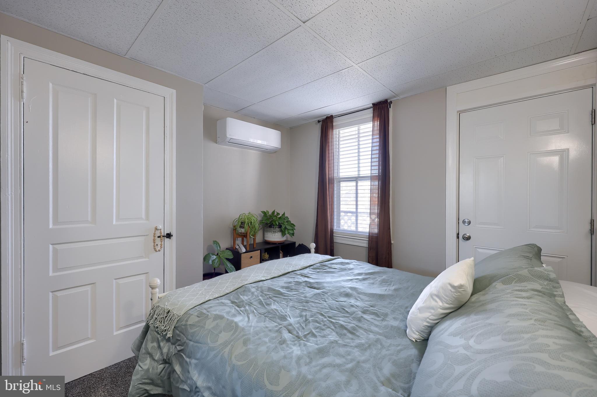 857 East Princess Street York, PA 17403 - Photo 17 of 38 a bedroom with a bed and window