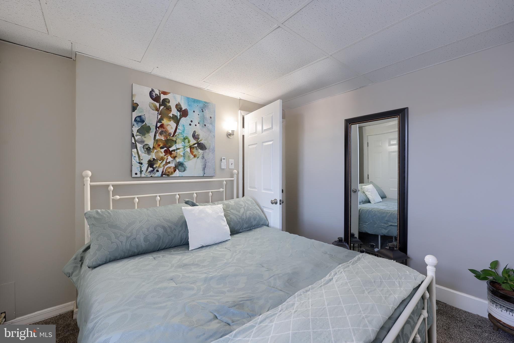 857 East Princess Street York, PA 17403 - Photo 18 of 38 a bedroom with a bed and painting on the wall