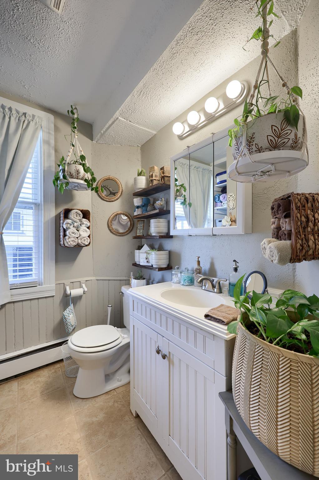 857 East Princess Street York, PA 17403 - Photo 19 of 38 a spacious bathroom with a double vanity sink toilet and a window