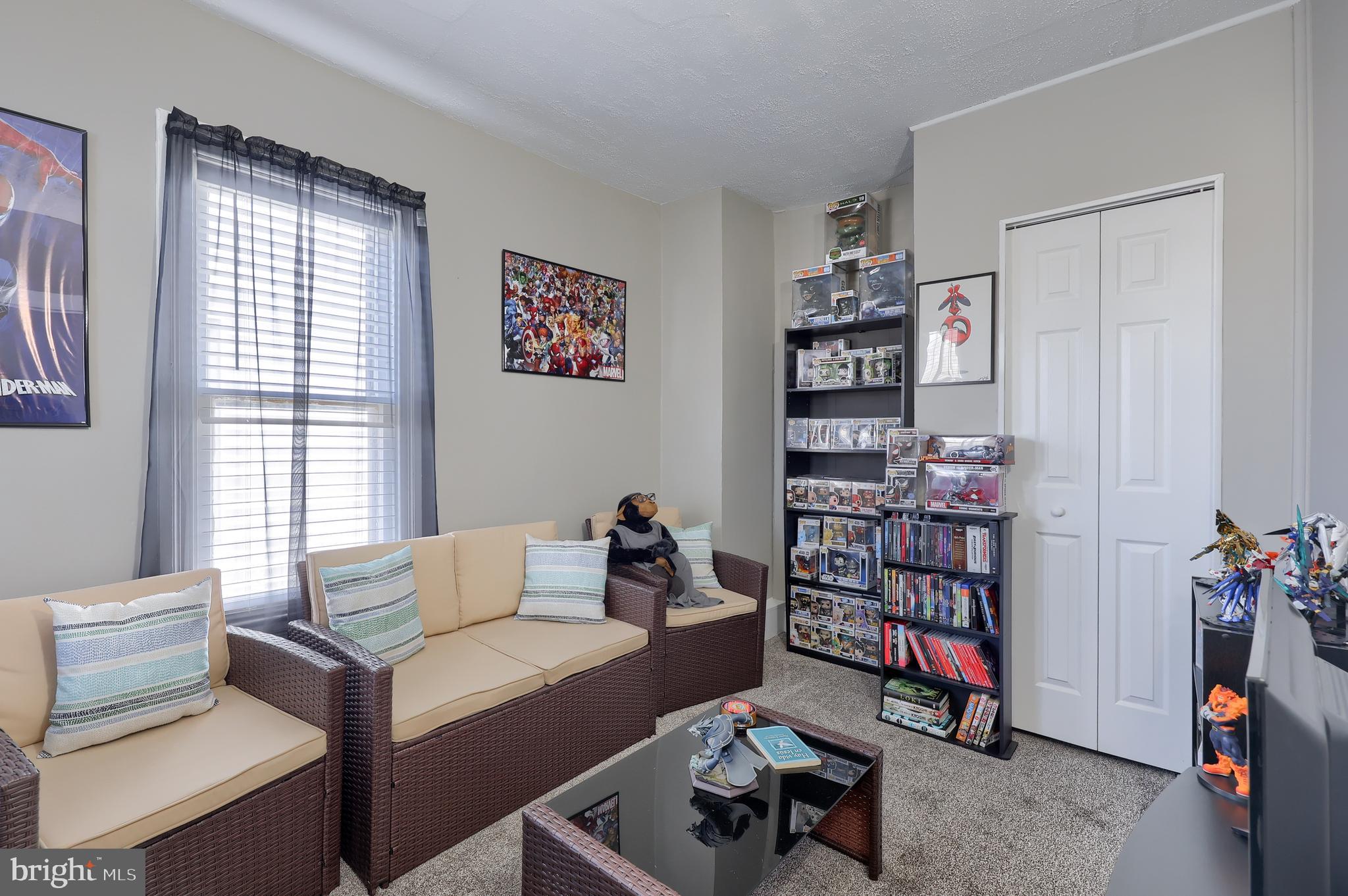 857 East Princess Street York, PA 17403 - Photo 20 of 38 a living room with furniture a bookshelf and a window
