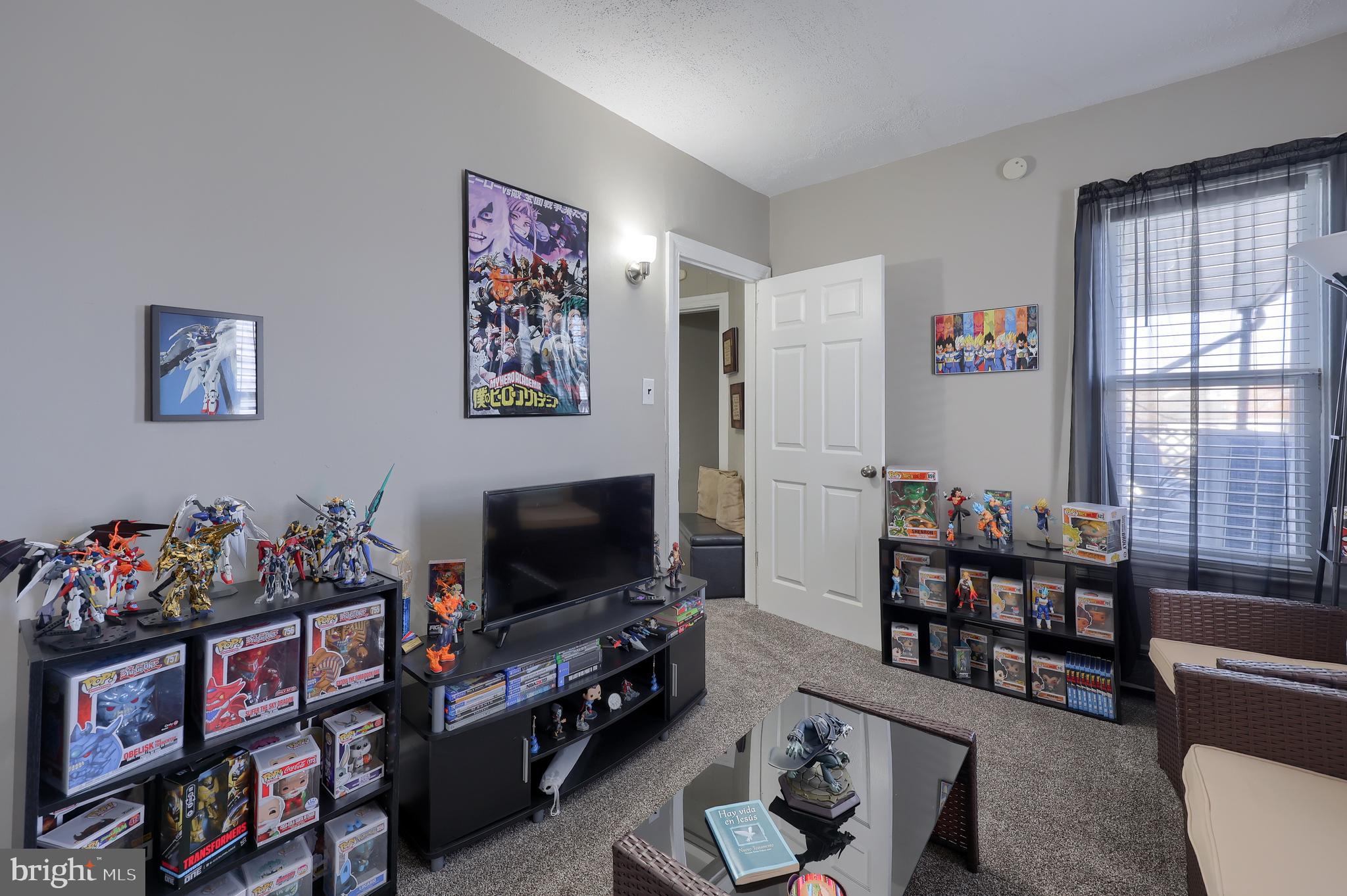 857 East Princess Street York, PA 17403 - Photo 21 of 38 a living room with furniture a window and a flat screen tv