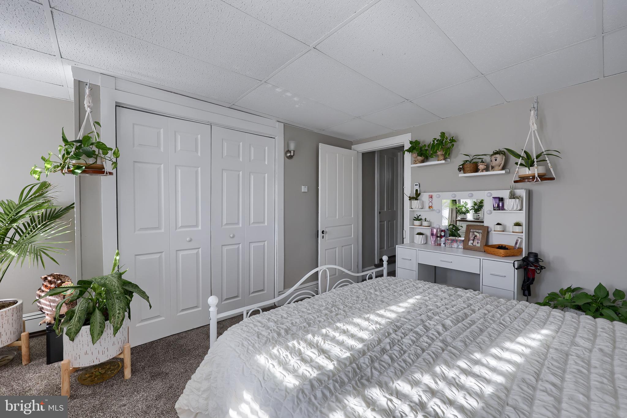 857 East Princess Street York, PA 17403 - Photo 25 of 38 a bedroom with a bed and a potted plant