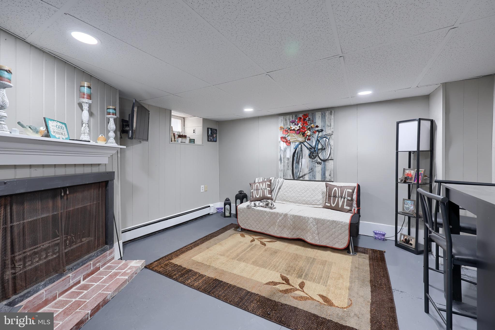 857 East Princess Street York, PA 17403 - Photo 26 of 38 a living room with furniture and a fireplace