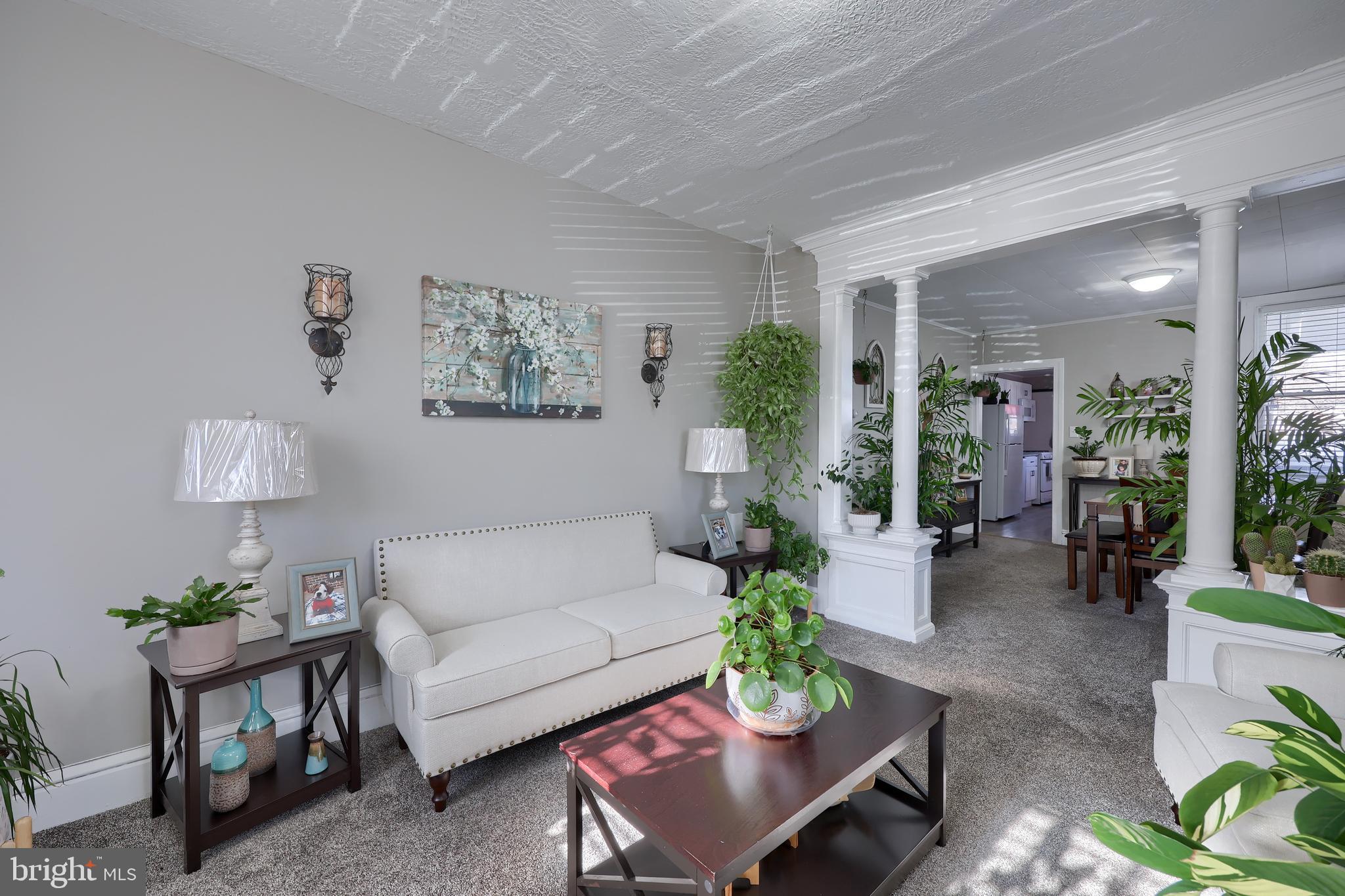 857 East Princess Street York, PA 17403 - Photo 8 of 38 a living room with furniture potted plant and a window
