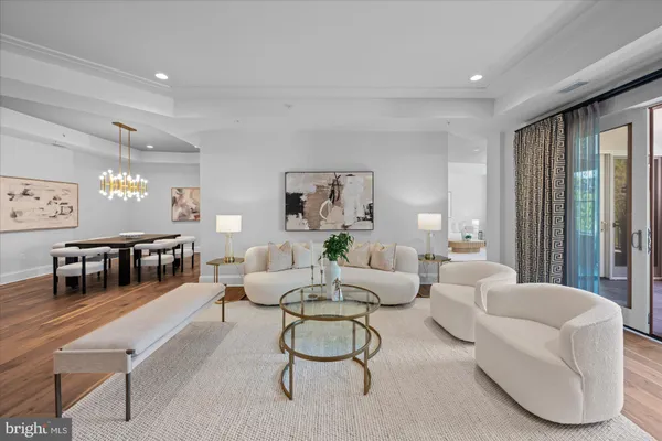 a living room with furniture and a table