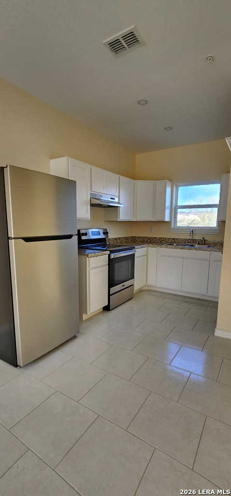 118 Grass Valley Road, Unit 201 Eagle Pass, TX 78852 - Photo 10 of 26 a kitchen with stainless steel appliances granite countertop a refrigerator a stove a sink and a