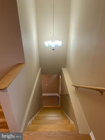 a view of a hallway with stairs