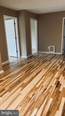 a view of a bedroom from a hallway