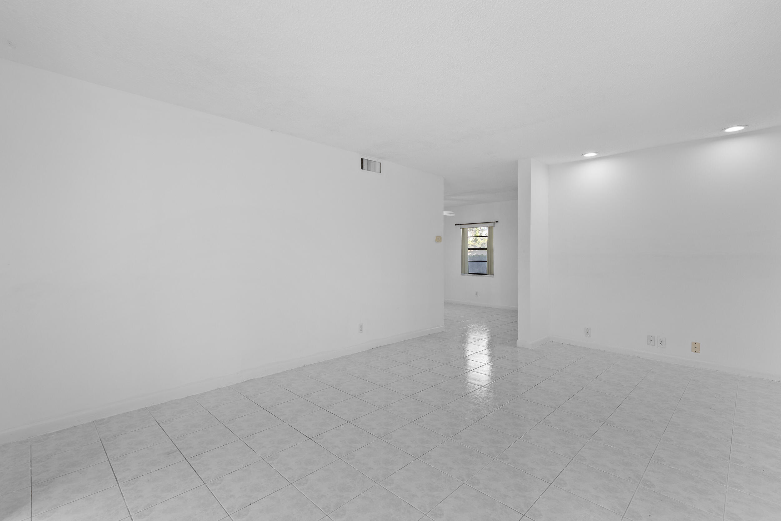 825 Northwest 13th Street, Unit 105 Boca Raton, FL 33486 - Photo 13 of 37 Living Room Overlooking Patio & Pool