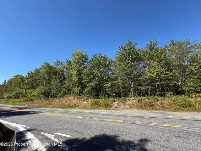 a view of a yard with a house