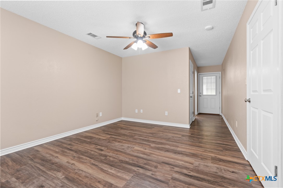 607 South Nancy Ann Street Hamilton, TX 76531 - Photo 11 of 26 a view of an empty room and wooden floor