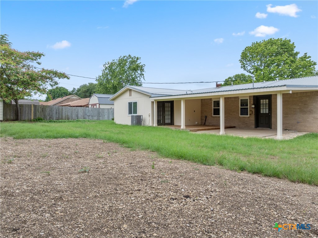 607 South Nancy Ann Street Hamilton, TX 76531 - Photo 22 of 26 a view of a house with a yard and potted plants