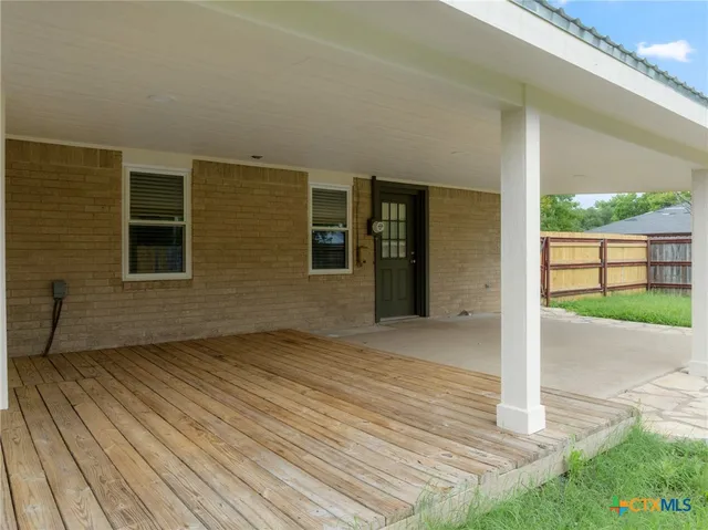 a view of backyard with green space