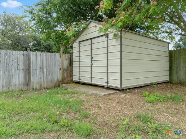 a house view with a backyard space