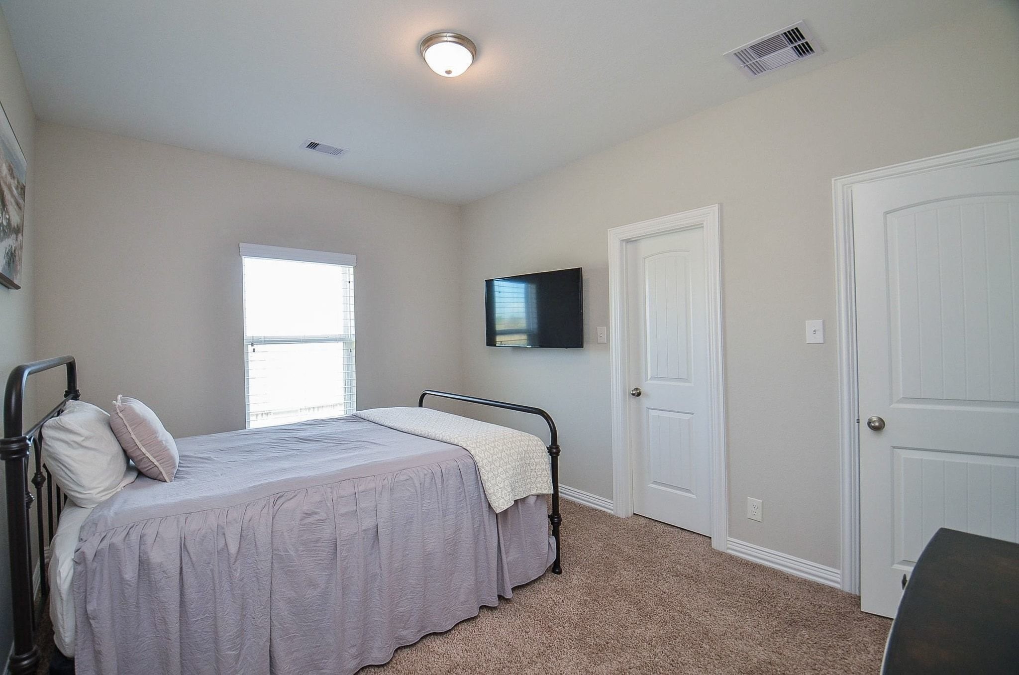 2714 Topaz Cove Lane Rosharon, TX 77583 - Photo 38 of 50 a bedroom with a bed and a window