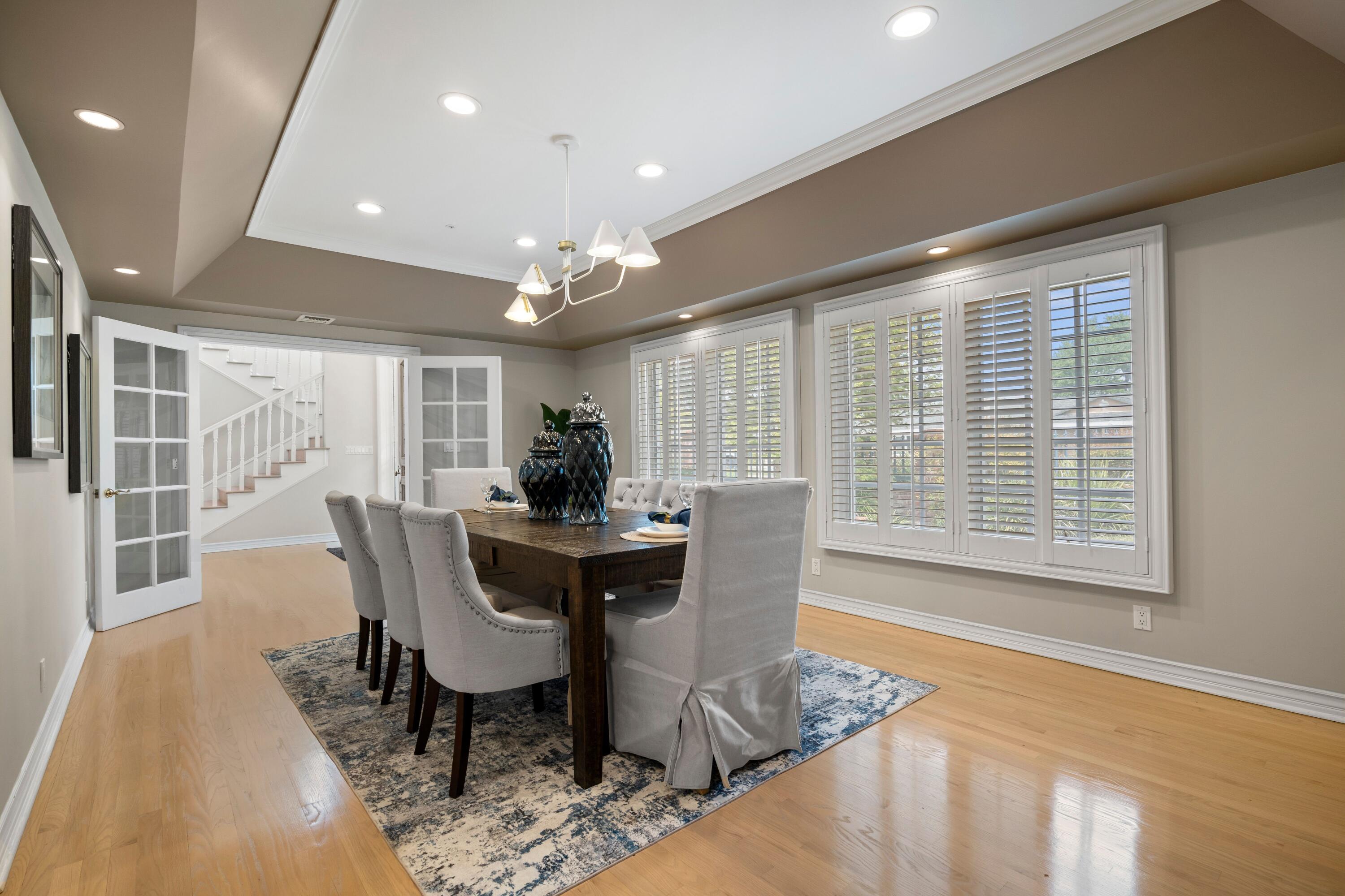 24335 Arcadia Street Newhall, CA 91321 - Photo 11 of 50 a view of a dining room with furniture and wooden floor