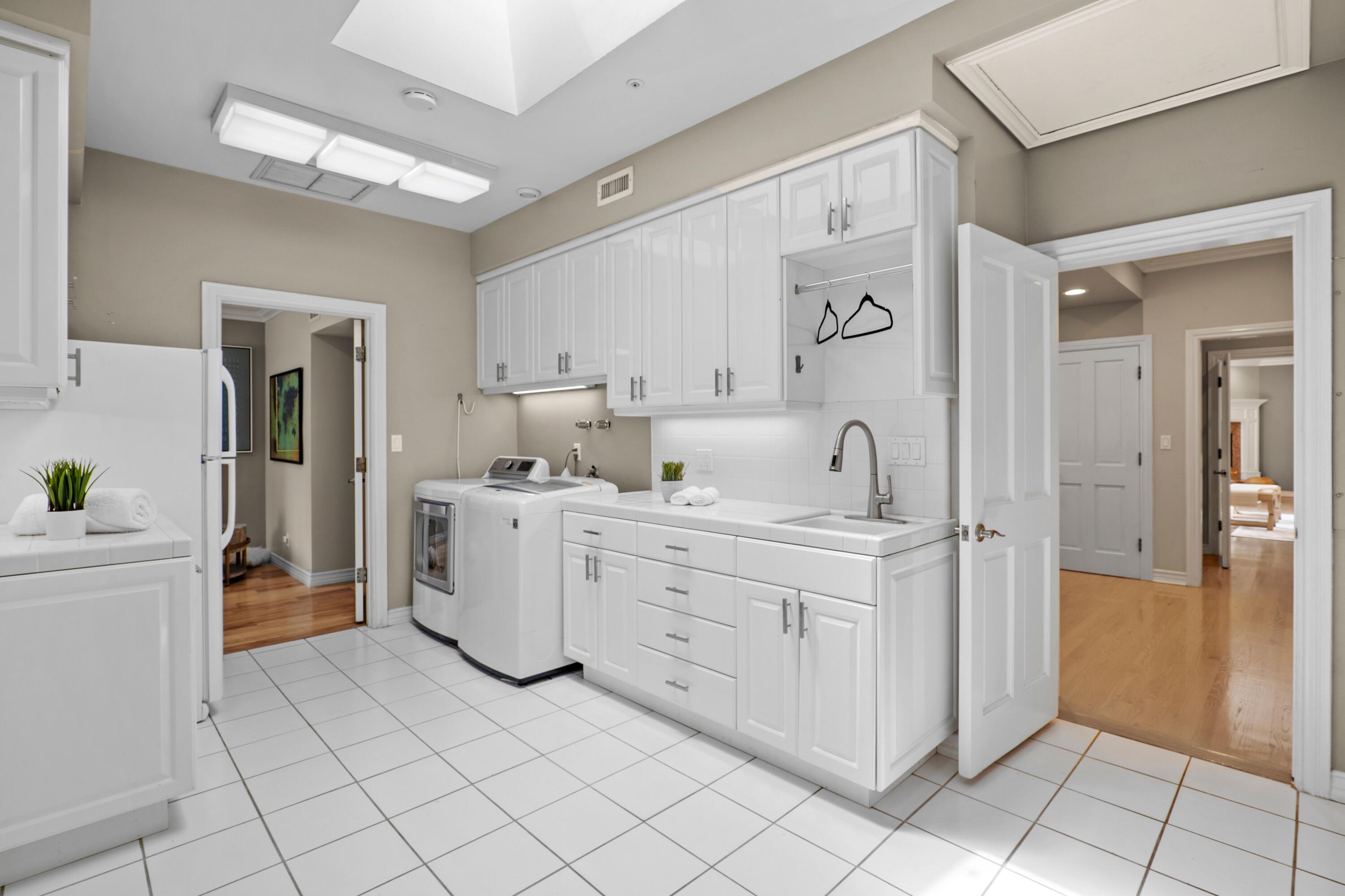 24335 Arcadia Street Newhall, CA 91321 - Photo 17 of 50 a kitchen with cabinets and window