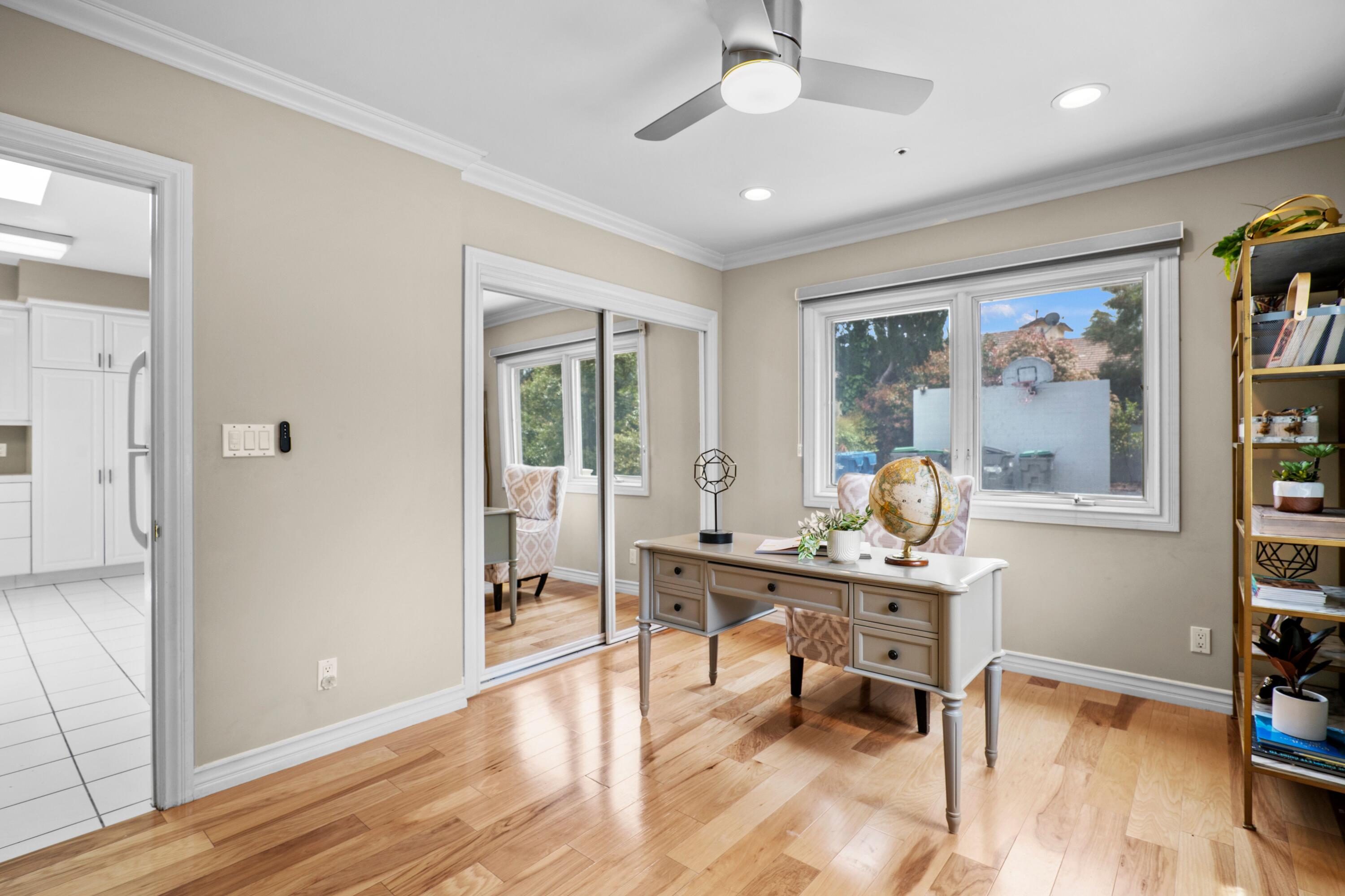 24335 Arcadia Street Newhall, CA 91321 - Photo 19 of 50 a view of a workspace with furniture and a window
