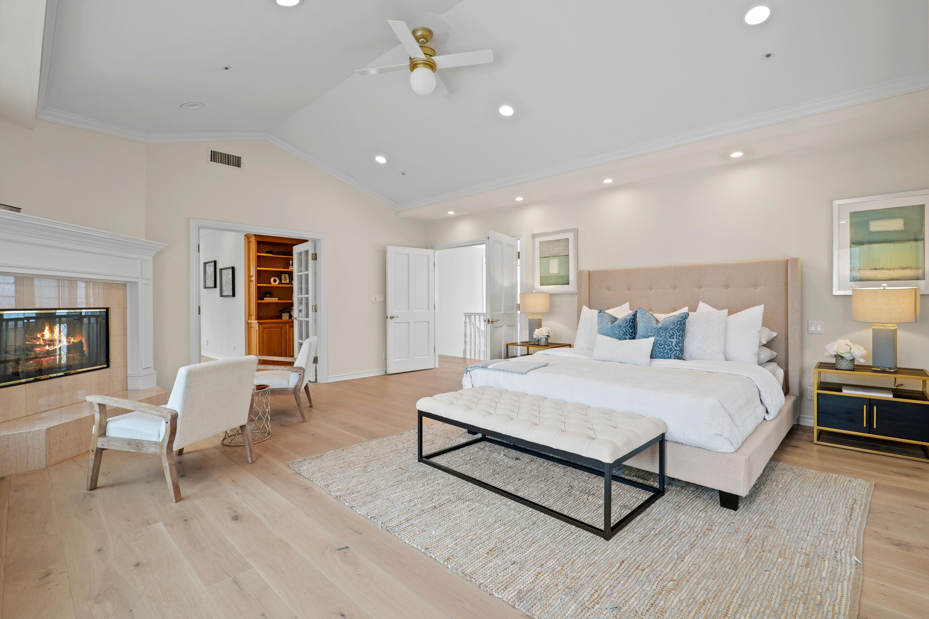24335 Arcadia Street Newhall, CA 91321 - Photo 23 of 50 a spacious bedroom with a bed couch and a window