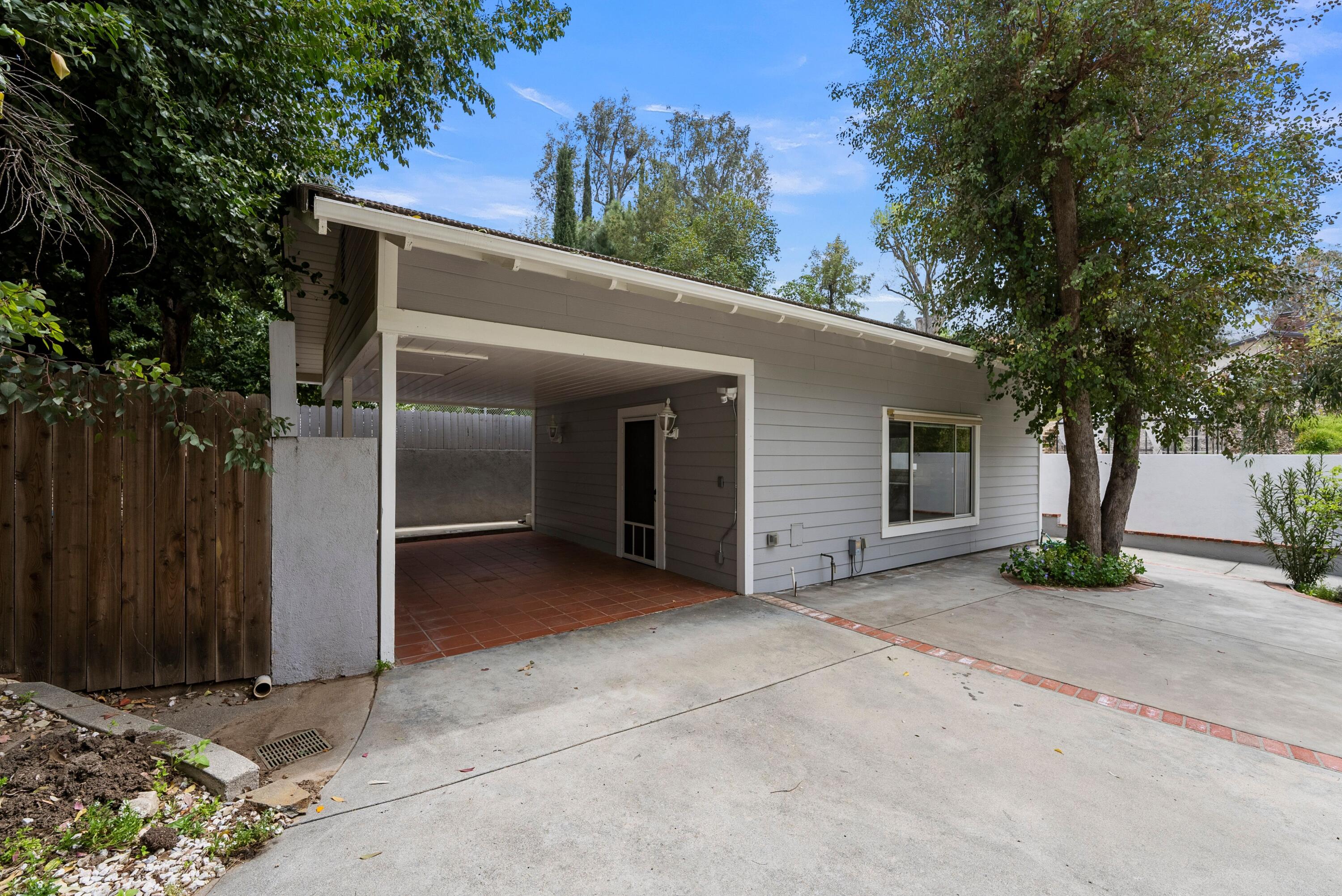 24335 Arcadia Street Newhall, CA 91321 - Photo 40 of 50 a view of a house with a tree in front of it
