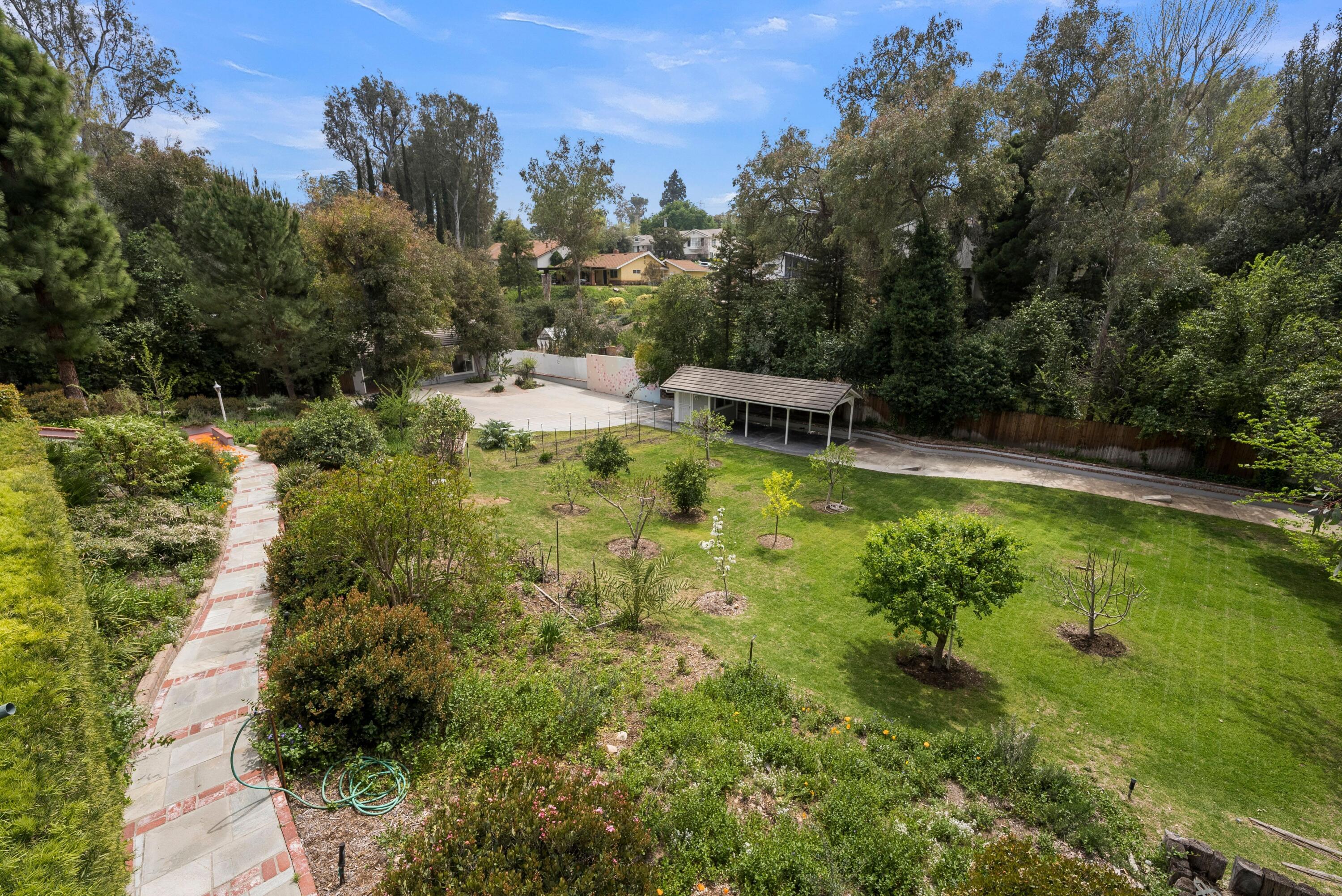 24335 Arcadia Street Newhall, CA 91321 - Photo 46 of 50 a view of a swimming pool with a yard