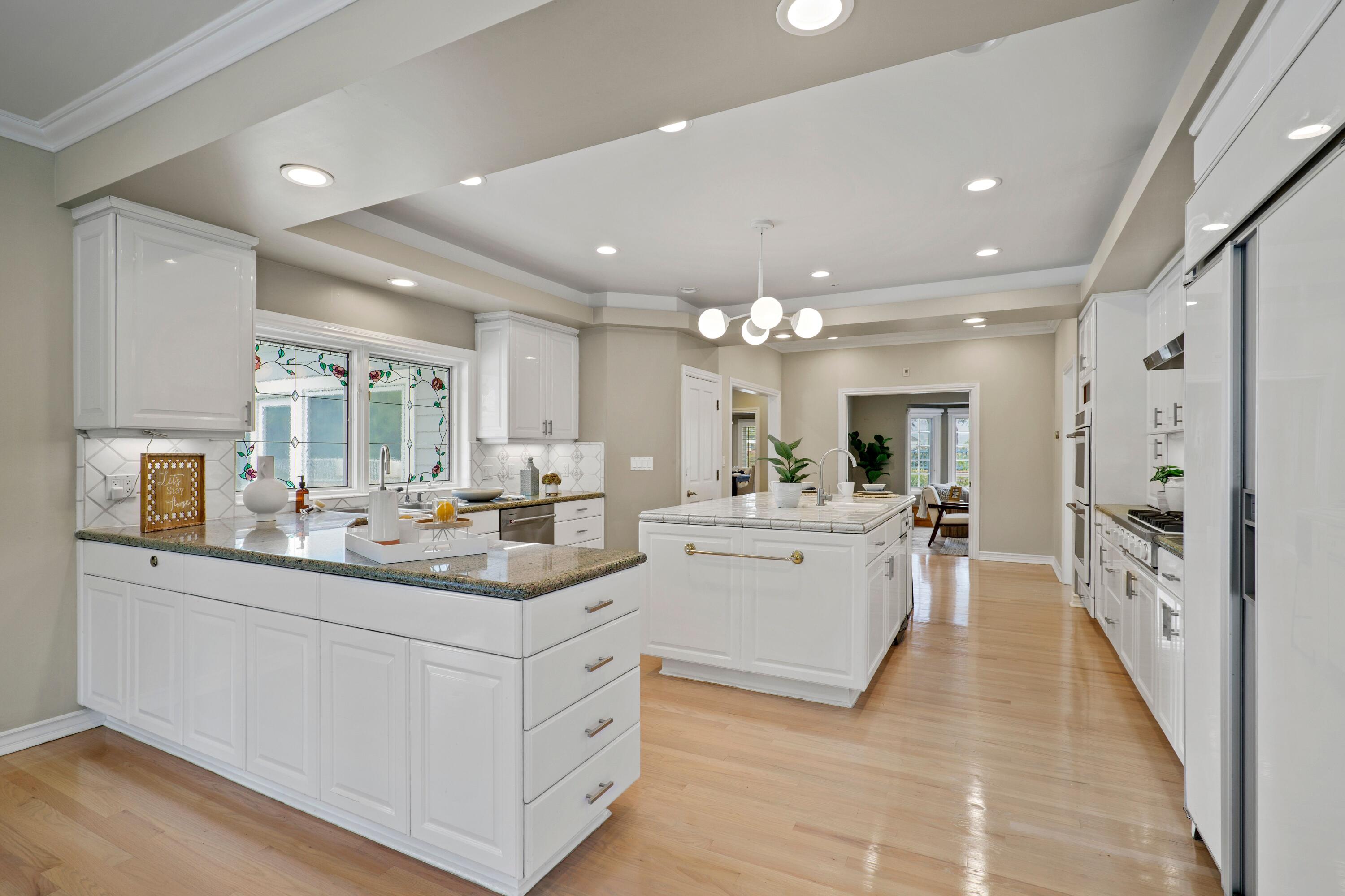 24335 Arcadia Street Newhall, CA 91321 - Photo 8 of 50 a view of a kitchen and living room with a sink
