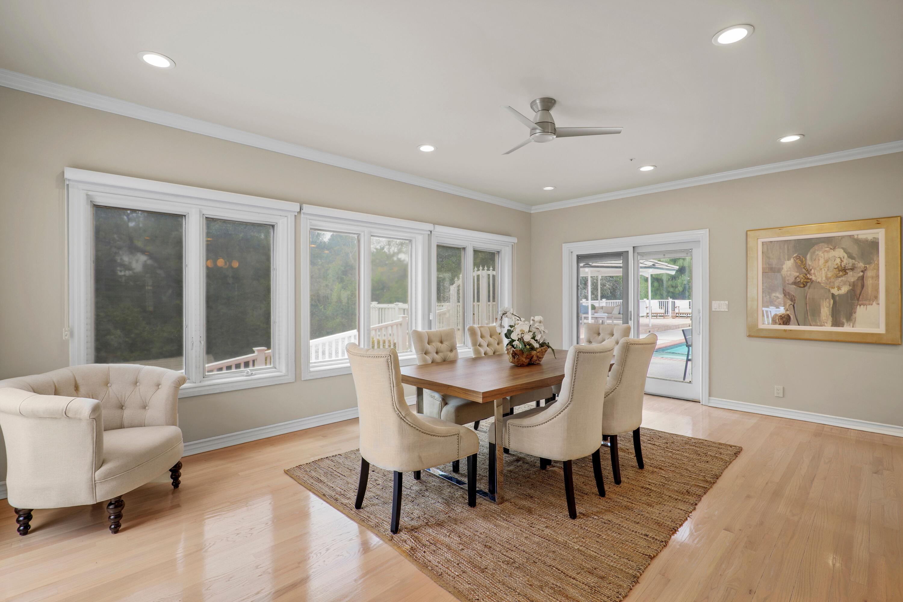 24335 Arcadia Street Newhall, CA 91321 - Photo 9 of 50 a dining room with furniture a rug and wooden floor