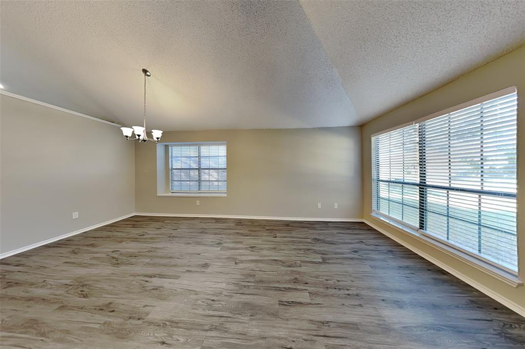 1602 Spring Street Allen, TX 75002 - Photo 6 of 20 wooden floor in an empty room with a window