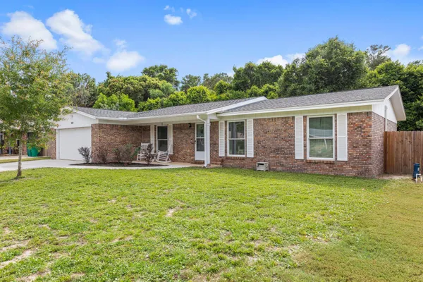 front view of a house with a garden